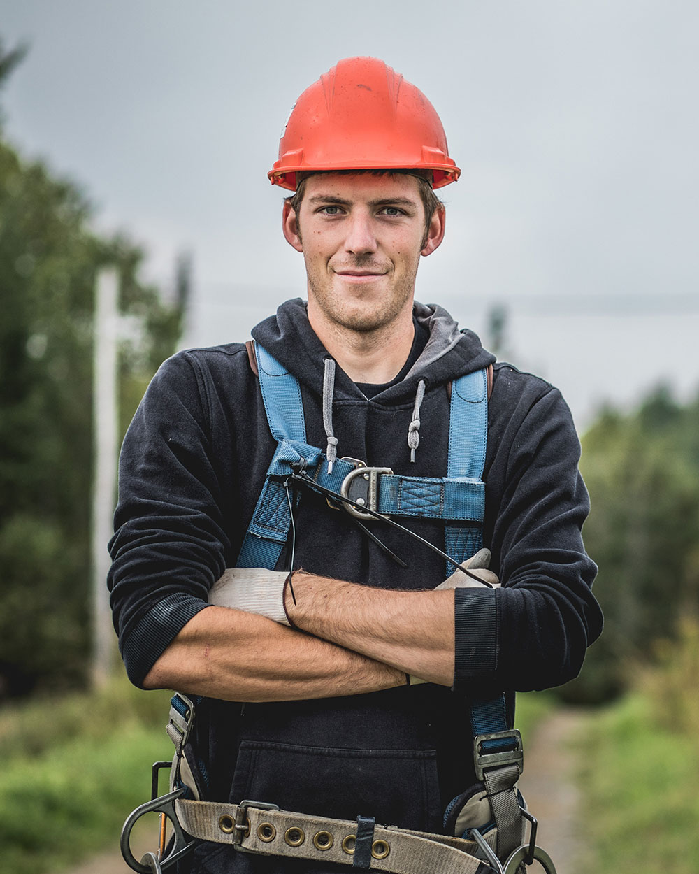 Cheerful technician at telecomtower P79JDCM